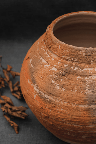 handmade clay pitcher unique antique stoneware vessel rustic ceramic pottery side view