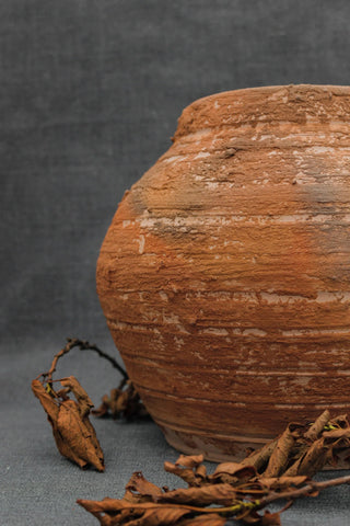 handmade clay pitcher unique antique stoneware vessel rustic ceramic pottery angle view