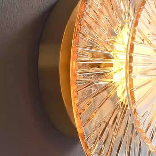 Gold LED sun wall sconce installed view chic interior