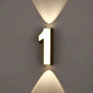 Number lit wall light close-up – black white typographic LED design