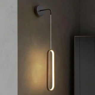 Modern oval wall sconce G4 installed hallway view