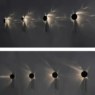 Black aurora borealis wall sconce G9 LED – installed bedroom setting