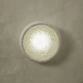 White resin wall sconce close-up soft diffused light
