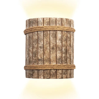 YAEL bohemian woven wall sconce installed bedroom