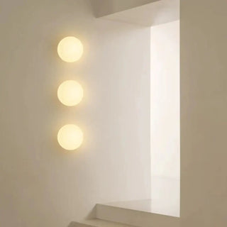 LUNEA white glass ball sconce close-up frosted surface