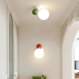 Close-up of colored glass ball wall sconce – white and green G9 7W
