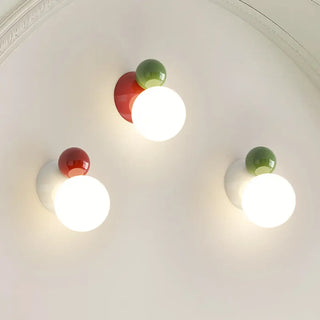 Dimmable glass ball wall sconce installed – green and white 12×16cm