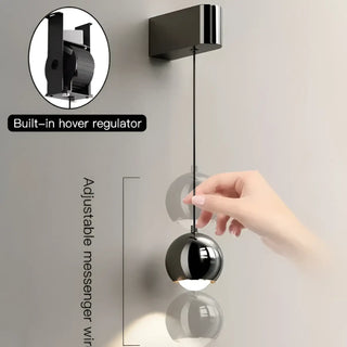 Modern acrylic ball wall sconce installed – black G4 12W warm light