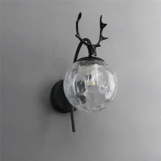 Deer antler wall light – glass globe gold black close-up