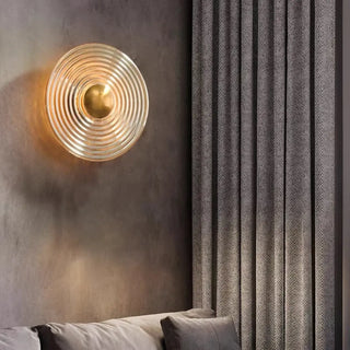 Sandy circular glass wall light installed – soft glow