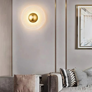 Sandy round LED wall sconce living room setting