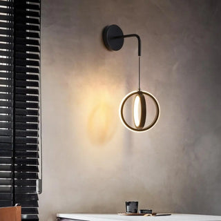 Contemporary gold wall sconce installed view bedroom