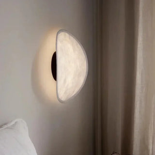 White half moon wall sconce side angle – minimal indoor design