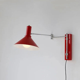 STUDIO articulated wall sconce installed reading nook
