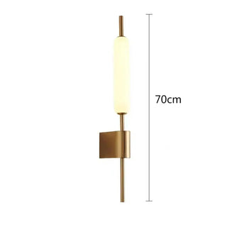 SUTURUS gold finish vertical wall light warm LED glow