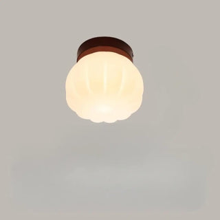 Modern round shade wall light installed view bedroom