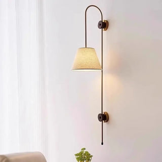 Brass wall sconce vintage brown fabric shade close-up