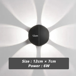 SUDULI black wall sconce halo glow installed view