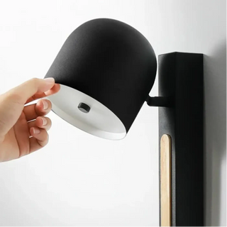 Matte black wall sconce side view cylindrical shade