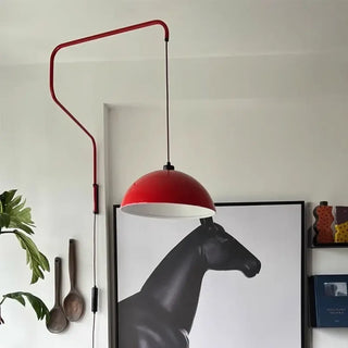 Bold red wall sconce installed view open plan loft