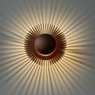 Soli black central disc wall sconce close-up
