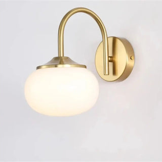 Pink round E27 wall sconce installed in modern bedroom