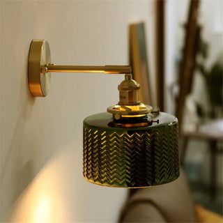 Gold wall sconce with green glass shade – elegant side angle