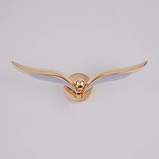 Sido gold bird wall light installed – warm glow poetic