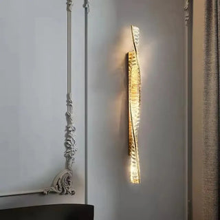 Art deco golden sconce installed – dimmable 3000K warm luxury accent