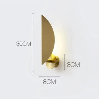 Gold LED wall sconce with switch installed bedroom view