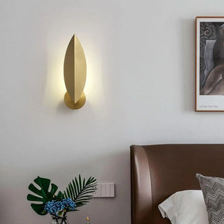 Gold wall sconce close-up metal switch detail modern