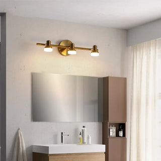 Gilded mirror wall sconce close-up – black gold luxurious accent detail