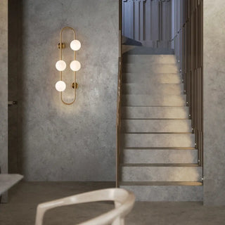 Nordic gold sconce installed – dramatic IP65 warm glass ball lighting