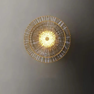 Round gold glass wall light installed view outdoor