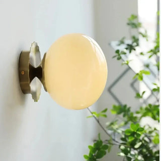 Pink wall sconce side view glass gold base elegant