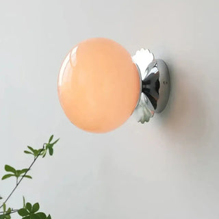 Pink glass sconce close-up gilded base LED 4000K