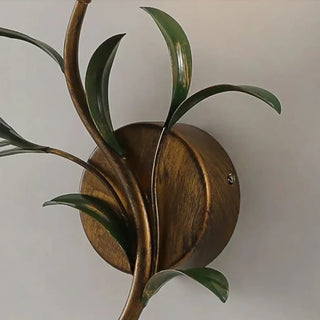 VONIA gold floral wall sconce installed bedroom