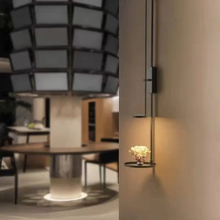 Functional black wall sconce with integrated shelf – modern bedroom