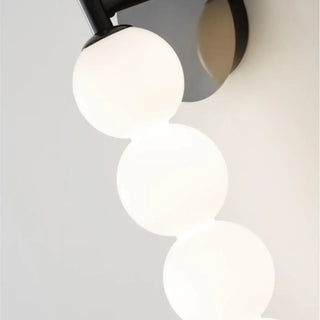 Multi-globe LED wall sconce gold glass – installed modern living room