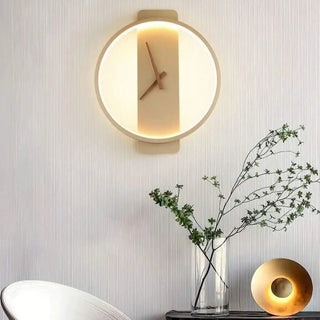Clock-shaped LED wall sconce gold finish close-up