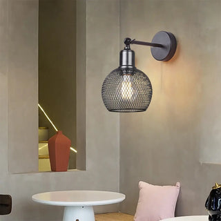 Industrial wall light close-up – black glass globe braided rope detail