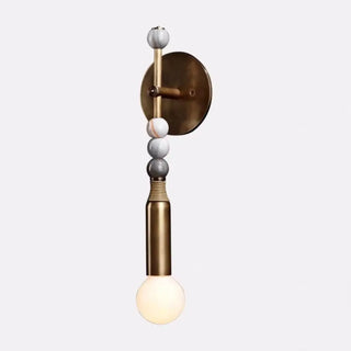 Brass and white glass wall light installed – gold LED indoor sconce