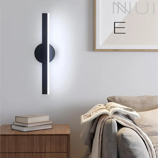 Slender minimalist black LED wall sconce interior design