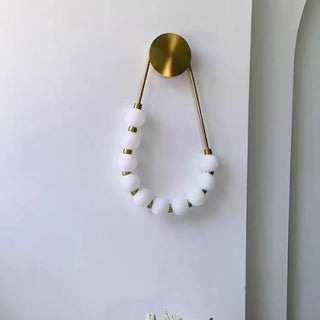 SUITY gold LED wall light globe balls warm detail
