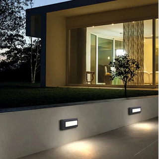 Black IP65 LED wall sconce installed on exterior facade