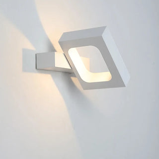 Black art deco wall sconce installed in boutique interior