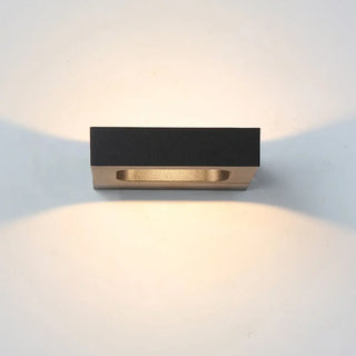 Compact geometric LED wall sconce 13x10cm installed in corridor