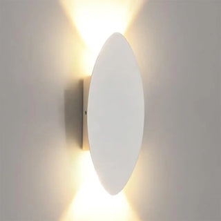 VATSIRA oval wall sconce installed bedroom modern