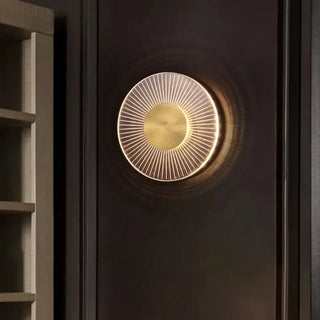 Ship sunburst wall sconce installed – warm radiant glow