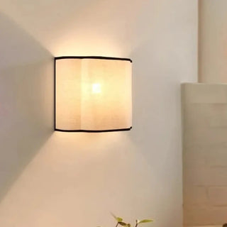 French cream linen wall sconce soft ambient lighting